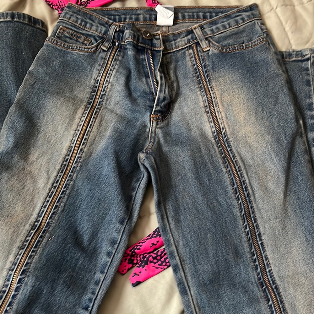 Jeans with zippers all the way down front of legs